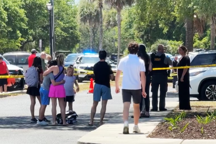 Residents and police in Sullivan's Island on Thursday.