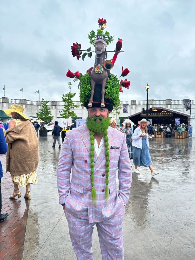Many fascinators are still covered up as the rain continues to come down here at Churchill Downs. There are a few (big) exceptions.