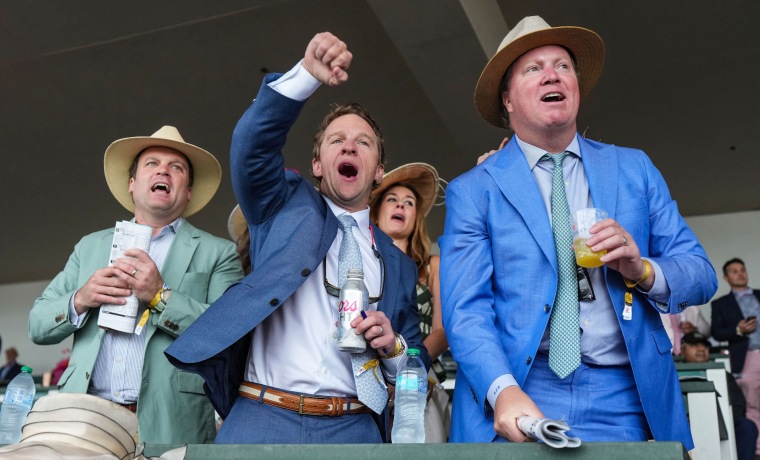 Fans yell in excitement while watching the races