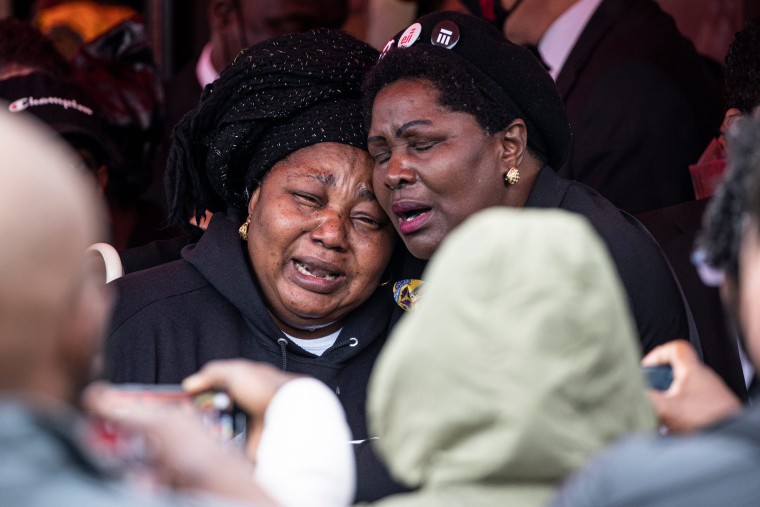 Dorcas Lyoya, mother of Patrick Lyoya, is comforted by a family member after her son's funeral at the Renaissance Church of God in Christ in Grand Rapids, Mich., April 22, 2022.