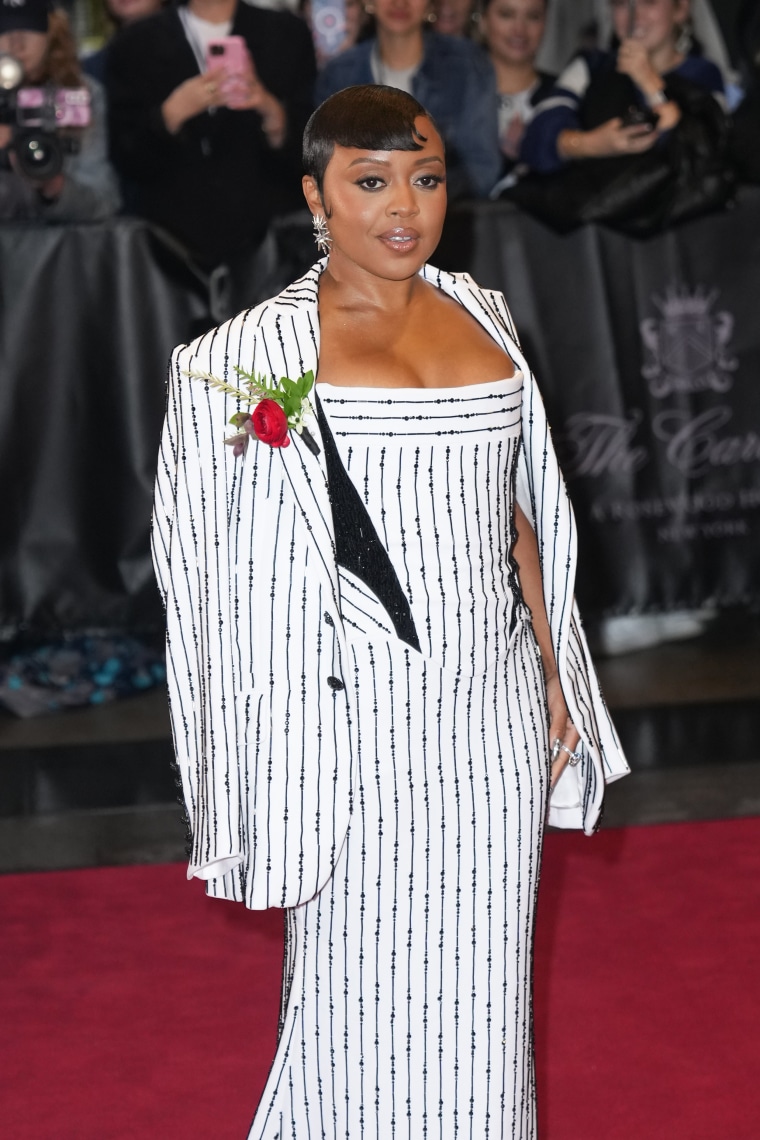 Quinta Brunson stuns in a black and white striped ensemble.