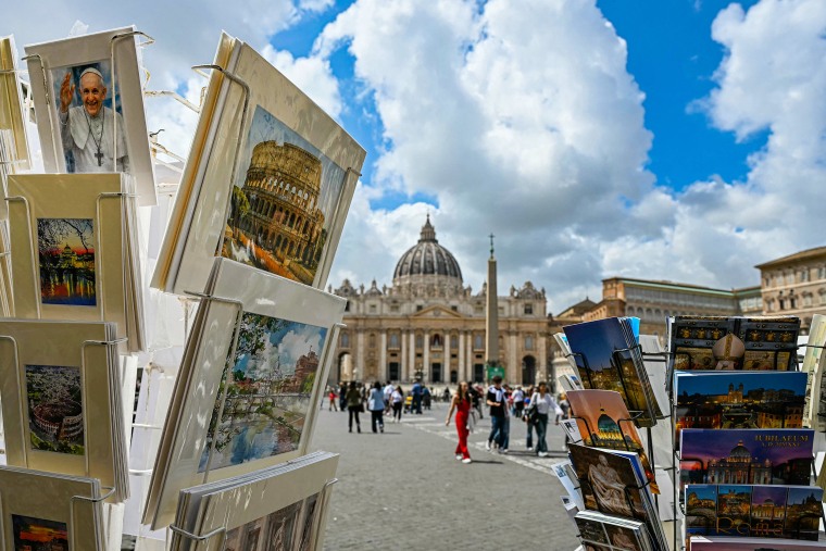 Tourist goods on sale outside St Peter's Basilica in Vatican City on May 5, 2025.