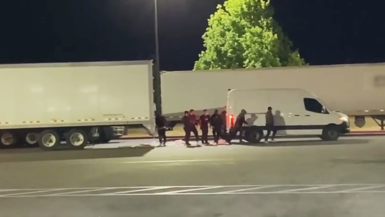 A group of suspects stealing cargo from a truck and loading it into their vehicle last year in California.