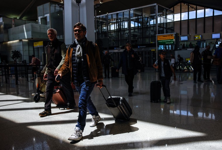 Image: Passengers arrive to Terminal B at Newark Liberty International Airport