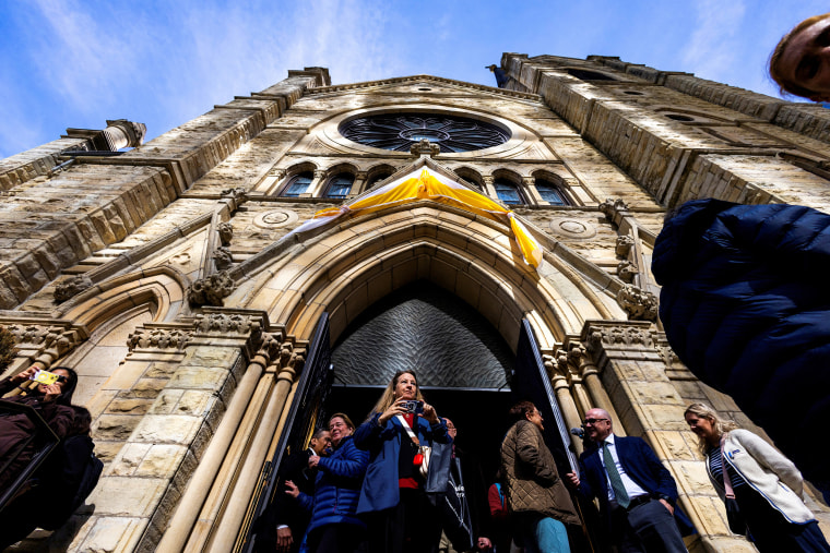 People exit the cathedral 