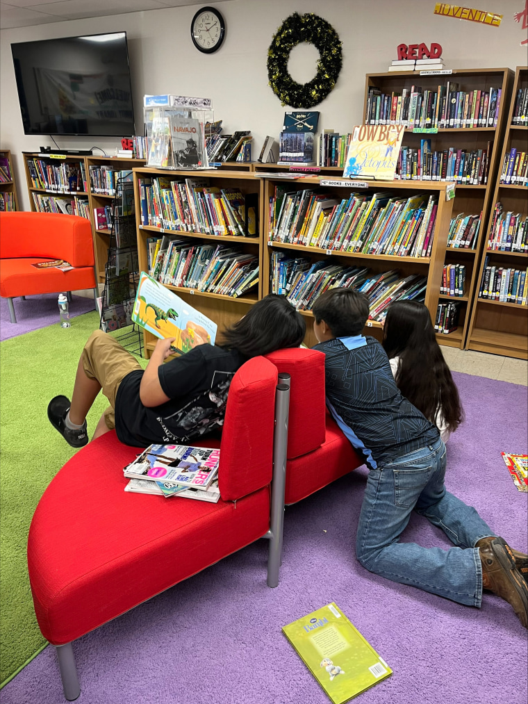 Children reading at the Santa Clara Pueblo Community Library.