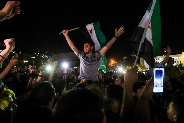 People celebrate in Damascus' Omeyyad square