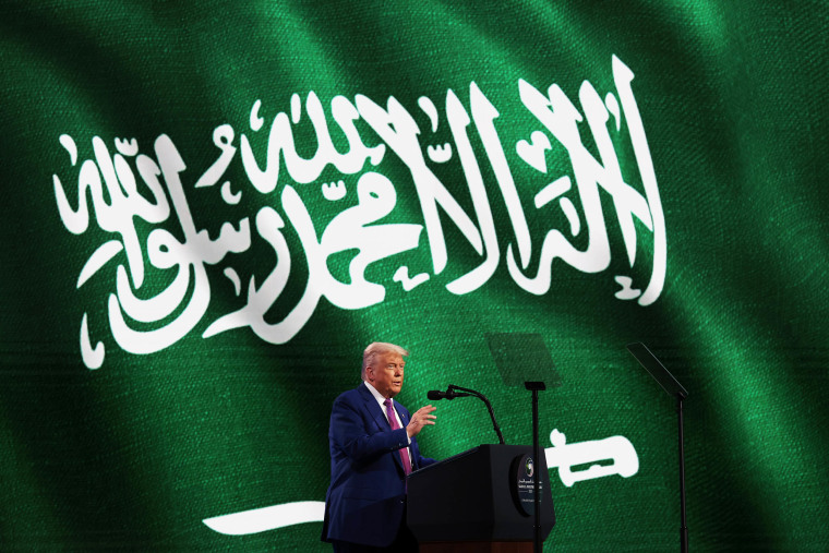 President Donald J. Trump stands at a lectern on stage and addresses