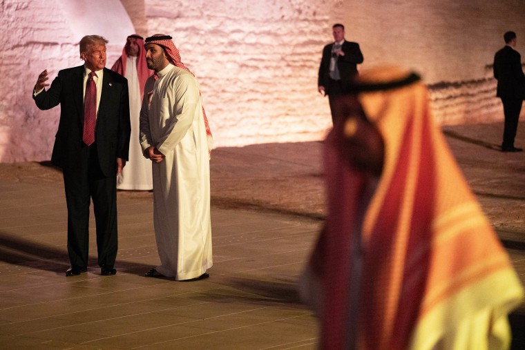 Donald Trump and Saudi Crown Prince Mohammed bin Salman walk in the old district of Diriyah 