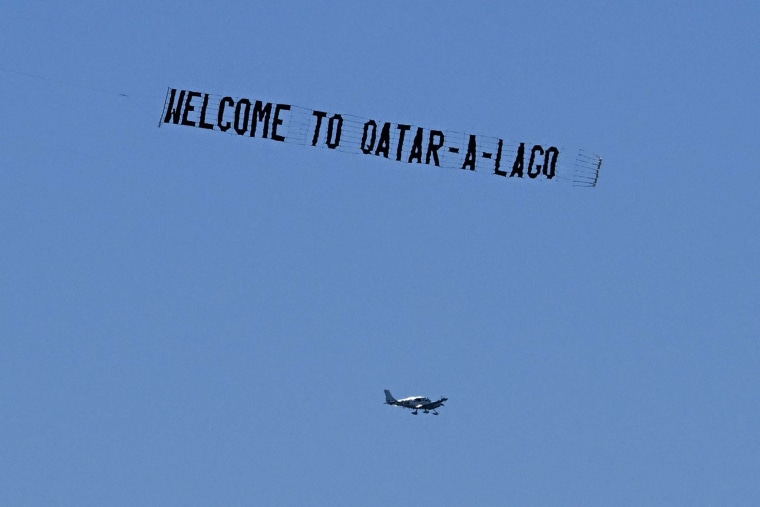 A banner with the words "Qatar-a-Lago"