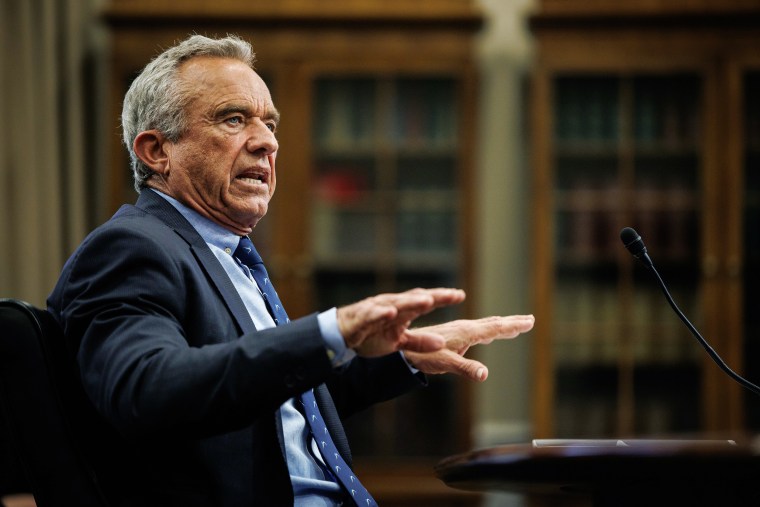 Robert F. Kennedy Jr. Gestes while talking at an audience.