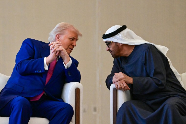 President Donald Trump speaks with UAE President Sheikh Mohamed bin Zayed Al Nahyan after his arrival at the presidential terminal in Abu Dhabi on May 15, 2025.