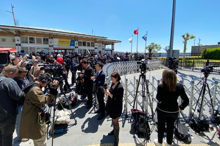 Journalists gather in front of the Dolmabahce Palace in Istanbul on Thursday.
