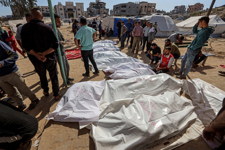 Covered bodies of Palestinians, who lost their lives after Israeli attacks, are brought to Indonesia Hospital in Gaza City