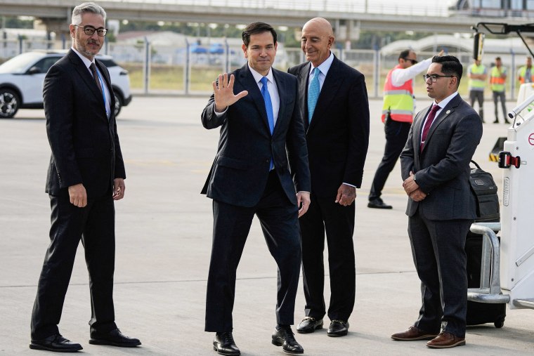 US Secretary of State Marco Rubio waves before boarding a plane
