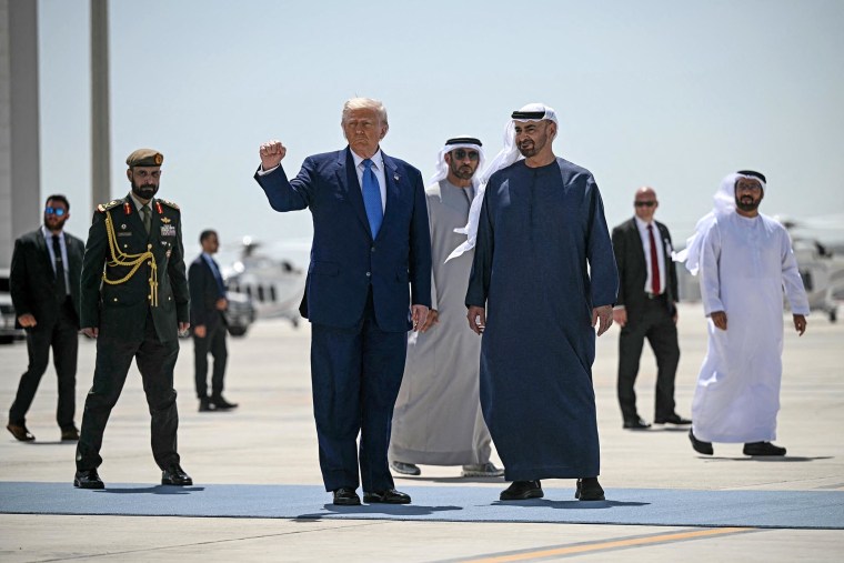 President Donald Trump is accompanied by his UAE counterpart Sheikh Mohamed bin Zayed Al Nahyan as he prepares to board Air Force One in Abu Dhabi at the end of his Middle East tour on May 16, 2025.