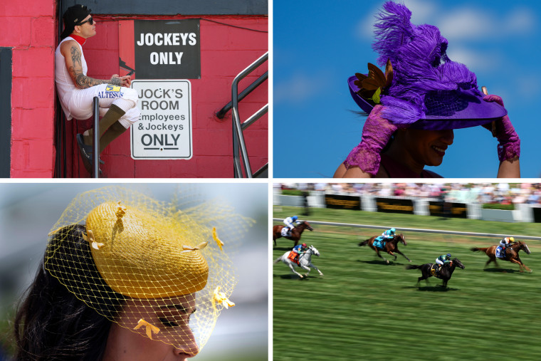 A jockey sits on the railing as guests in decorative hats arrive for the 150th Preakness Stakes