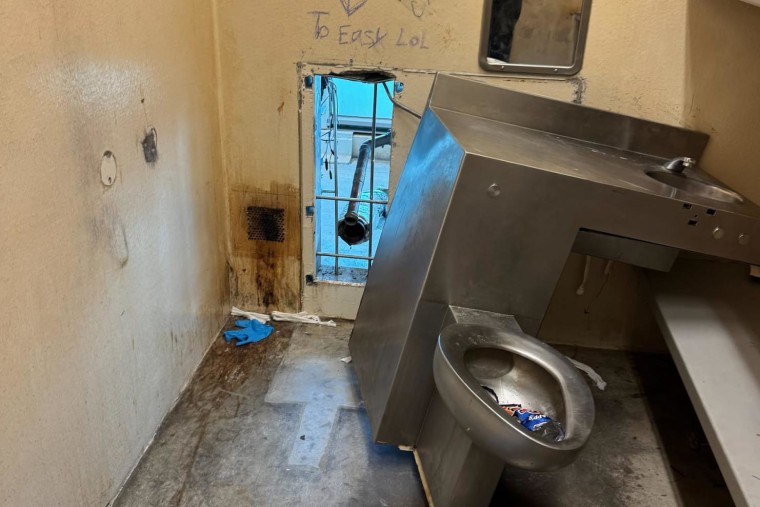Prisoners at the Orleans Parish jail escaped through in the wall behind a toilet.