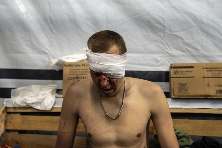 Ukrainian soldiers receive medical treatment at a stabilization point in Donetsk Oblast