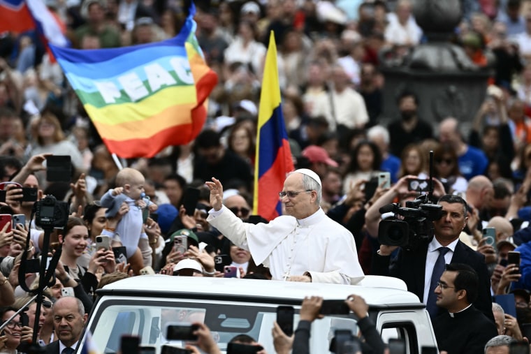 Pope Leo XIV prays at the end of his first weekly general audience at St Peter's Square in The Vatican on May 21, 2025.