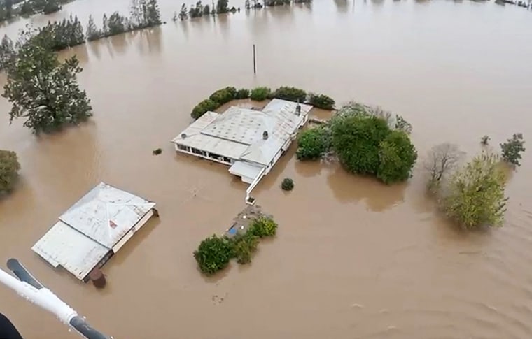 Police Force shows a police helicopter rescue in flooded areas near the NSW town of Taree.