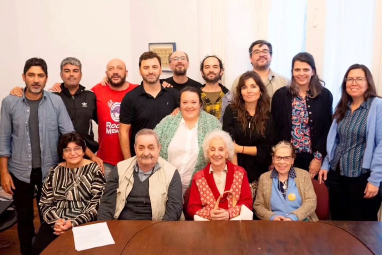 Belén Estefanía Altamiranda, third from right in the middle row, with members of the Grandmothers of the Plaza de Mayo, whose work has helped identify the children of some of the disappeared.