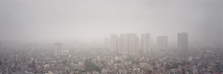 Hanoi disappears under layers of construction dust, exhaust fumes and road grit, pollution sources that regularly push the city to the top of global air quality rankings.