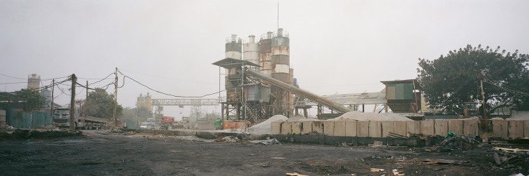 A concrete mixing station at Hanoi's Lien Mac Port, a link in the chain fueling Vietnam's rapid urbanization and contributing to air pollution.
