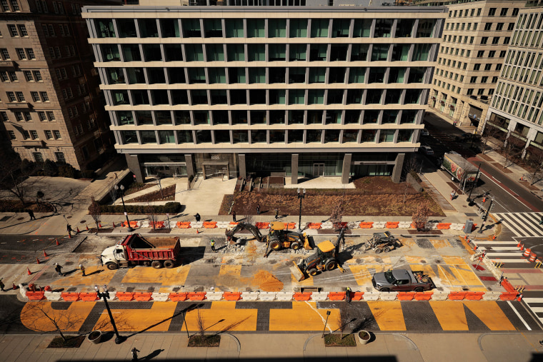 Crews use concrete saws, jackhammers and excavators as they continue to dismantle the Black Lives Matter Plaza street mural