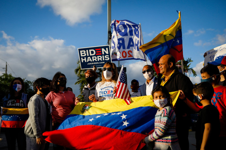 Venezuelans holding flags.