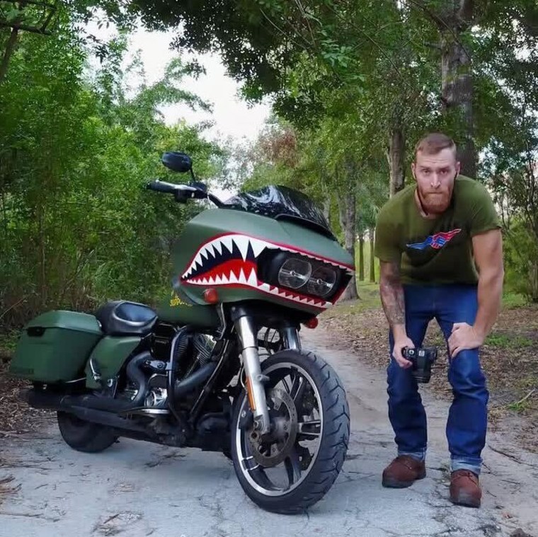Brandon "Mister" Fees posed for a photo near his motorcycle.