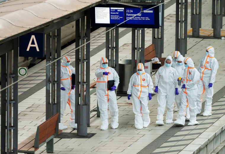 Forensic police investigate the railway platform