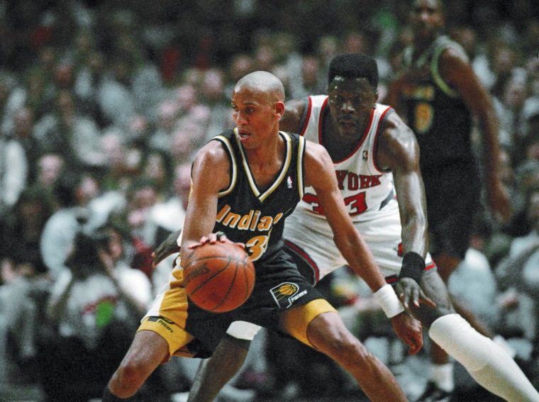 Indiana Pacers guard Reggie Miller is guarded by New York Knicks center Patrick Ewing
