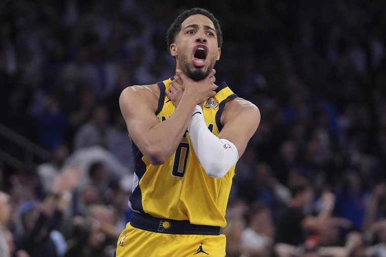 Indiana Pacers guard Tyrese Haliburton makes a choking gesture after hitting a shot at the end of Game 1 of the NBA basketball Eastern Conference final on May 21, 2025, in New York.