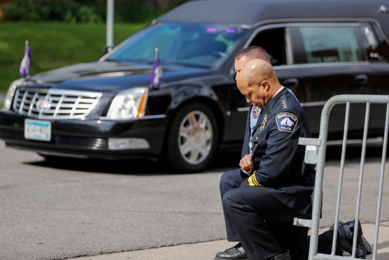 Police officers, including Minneapolis Police Chief Medaria Arradondo.