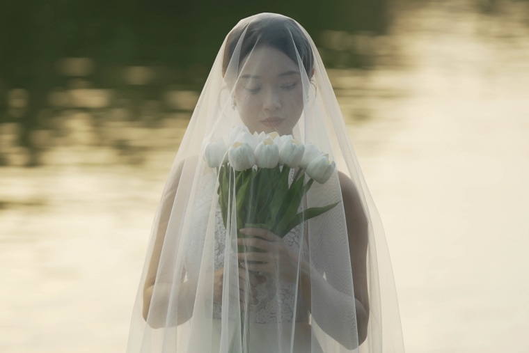 A bride poses during a wedding photo shoot in the Forbidden City, Beijing, in March 2025.