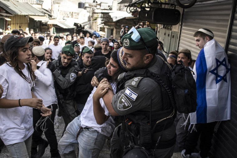 Israeli police remove a right-wing activist 