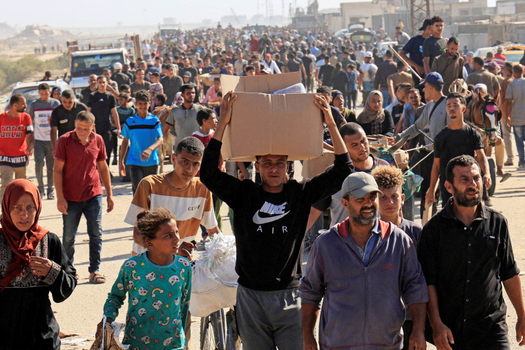 Palestinians seeking aid gather near an aid distribution site run by the U.S.-backed Gaza Humanitarian Foundation, in Rafah