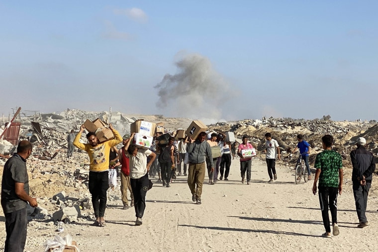 People carrying food packages