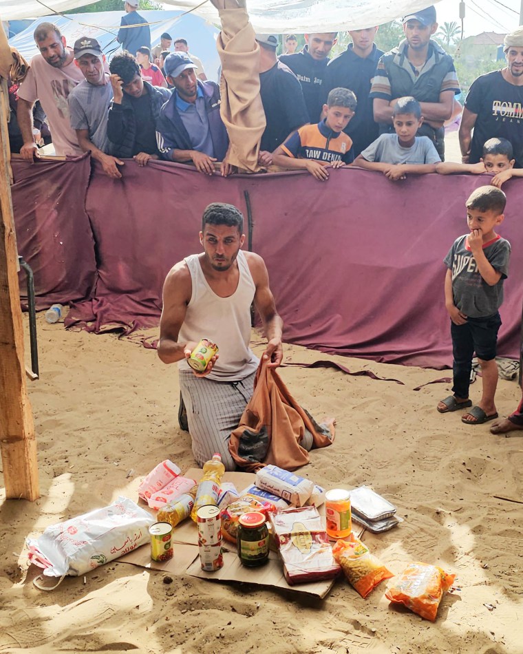 Palestinians receive food packages