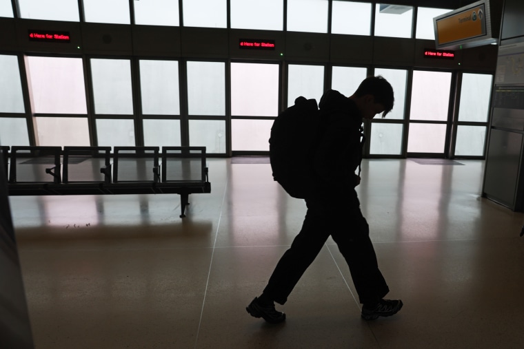 A passenger walks through Newark Liberty International Airport on May 23, 2025, in Newark, N.J.