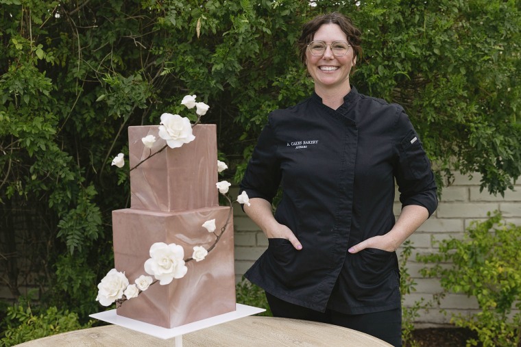 Armana Christianson in Mesa, Ariz., with one of her wedding cake creations. 