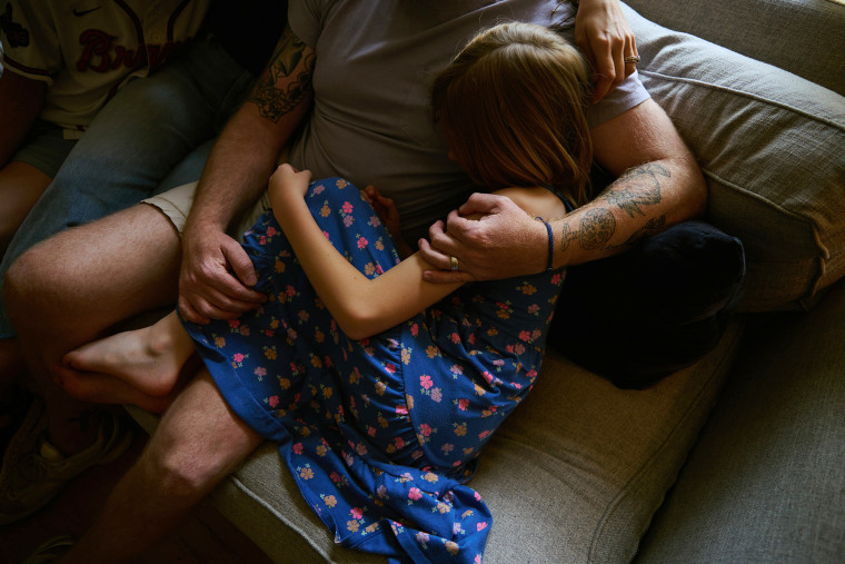 Chase, a 9-year-old trans girl, sits with her parents, Candace and Brandon, as their family prepares for a life-changing move to New Zealand.