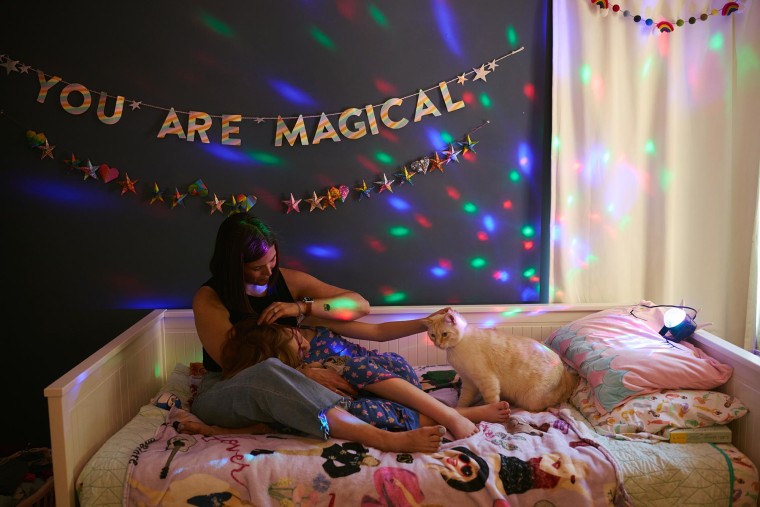 Chase, a trans girl, shares a quiet moment with her mom, Candace, in Chase's bedroom.