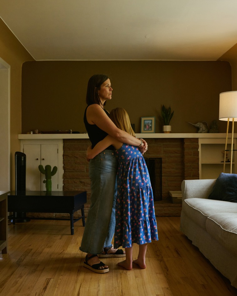 Chase and her mom in their living room.