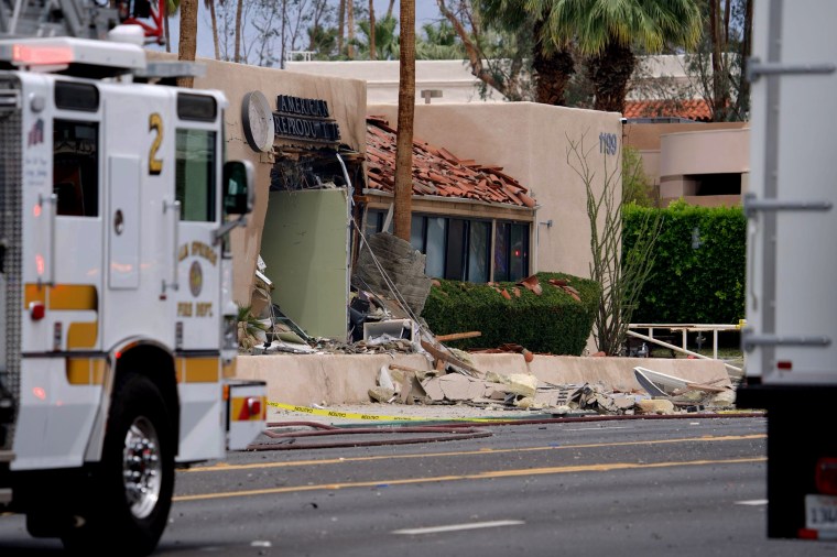 Authorities investigate a car explosion in Palm Springs
