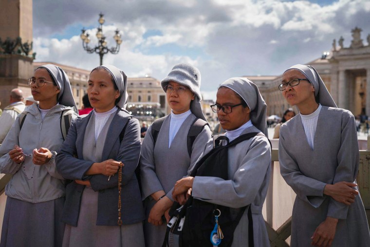 Nuns pray on St Peter's Square on the second day of the conclave, in the Vatican on May 8, 2025.