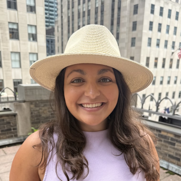 Producer Jillian Gonzales tries the Furtalk Wide Brim Panama Sun Hat.