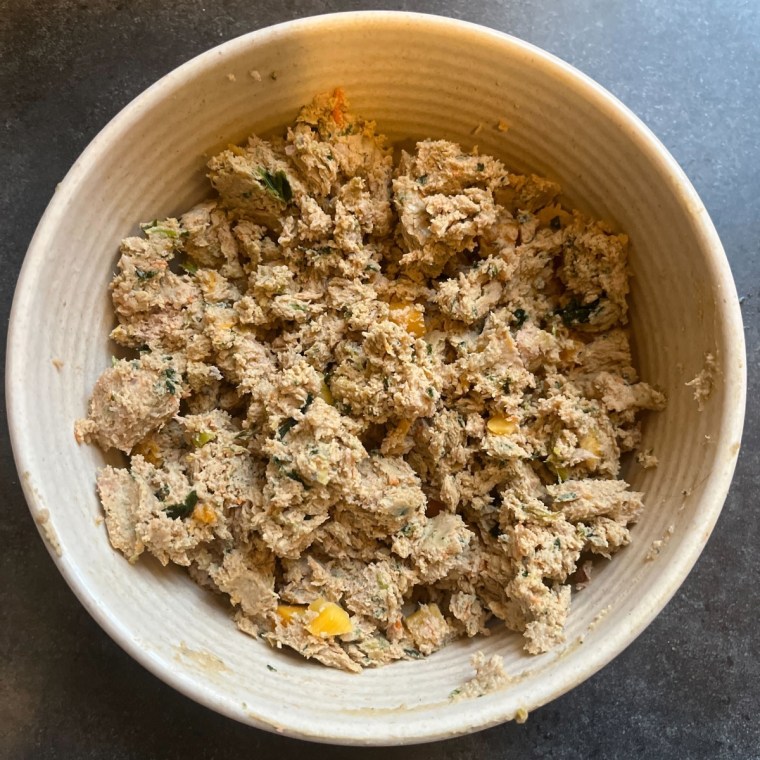 White bowl with fresh dog food