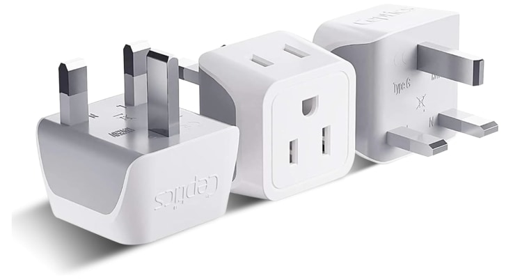 A U.K. to U.S. plug adapter, shown sitting on three different sides